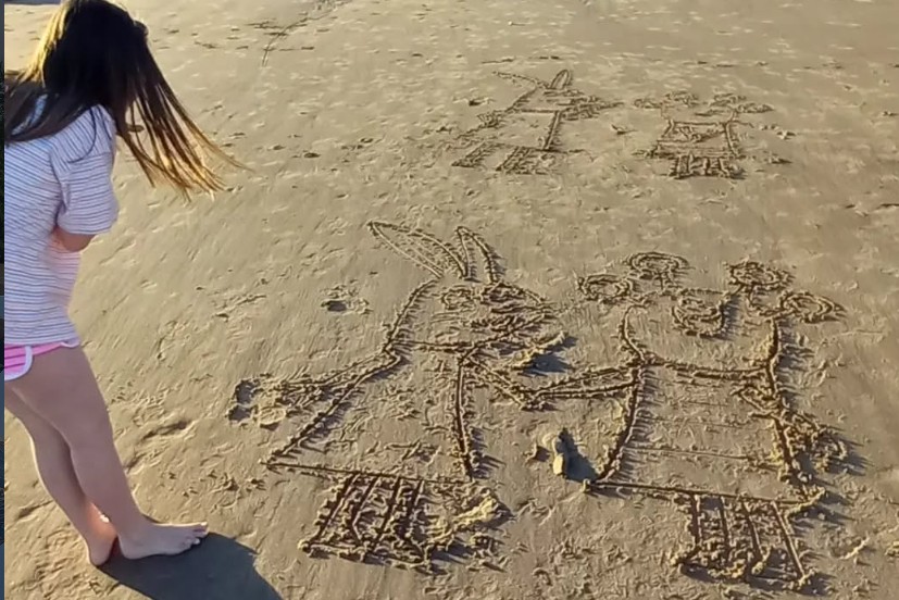 Drawings in the sand — Kya and Dad's weekly beach tradition