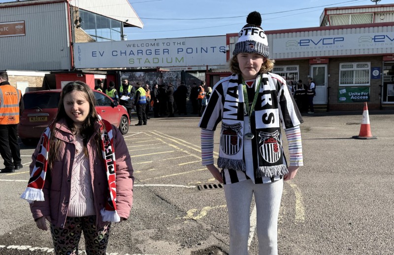 Kya and Martha at a football ground &ndash; match day smiles